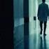 Medical Doctor In The Hospital Walks Out Of The Dark Corridor Into The Light Stock Footage