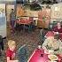 A Heartwarming Moment As A Young Boy Salutes A Marine In A Restaurant Shorts