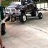 Mini Rollback Pulling The 2 Car Trailer Gooseneck Trailer And Powered Ride On Grave Digger