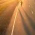 MAN AND WOMAN RUNNING AT SUNSET AERIAL 4K